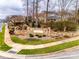 Stone entrance sign to Prescot community with landscaped garden and sidewalks at 8312 Compton Acres Ln, Waxhaw, NC 28173