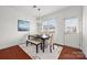 Bright dining room featuring a modern table, four chairs, a bench and a modern light fixture at 8312 Compton Acres Ln, Waxhaw, NC 28173