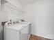 Convenient laundry room with washer, dryer and wire shelving at 8312 Compton Acres Ln, Waxhaw, NC 28173