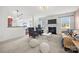 Spacious living room featuring a fireplace, sofa, two chairs, breakfast bar and open concept at 8312 Compton Acres Ln, Waxhaw, NC 28173