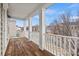 A covered front porch with wood floors and white railing at 8312 Compton Acres Ln, Waxhaw, NC 28173