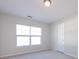 Bright bedroom with window and access door at 9613 Long Hill Dr, Charlotte, NC 28214