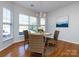 Cozy dining area featuring natural light and a table set for four with chandelier at 9613 Long Hill Dr, Charlotte, NC 28214