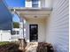 Inviting front entrance with a black door and decorative columns at 9613 Long Hill Dr, Charlotte, NC 28214