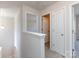 Bright hallway features neutral walls, carpet floors and white doors at 9613 Long Hill Dr, Charlotte, NC 28214