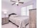 Cozy bedroom with neutral tones featuring a ceiling fan, and a comfortable bed at 102 W Vista View Pl, Mooresville, NC 28117