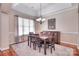 Cozy dining room with a chandelier and large window with patterned curtains at 102 W Vista View Pl, Mooresville, NC 28117