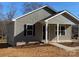 Gray house with black shutters and a front porch at 1027 Adams St, Statesville, NC 28677