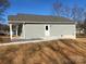 Gray house with a side porch and a back patio at 1027 Adams St, Statesville, NC 28677