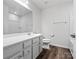 Modern bathroom with a sleek vanity, large mirror, and shower/tub combination at 1036 Barnette Farm Ln, Monroe, NC 28110