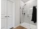 Modern bathroom featuring a glass-enclosed shower with gray tile surround and modern hardware at 1036 Barnette Farm Ln, Monroe, NC 28110