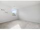 Bright bedroom with neutral carpeting and a large window providing plenty of natural light at 1036 Barnette Farm Ln, Monroe, NC 28110