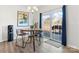 Cozy dining area with a modern chandelier and sliding glass doors to the backyard at 1036 Barnette Farm Ln, Monroe, NC 28110