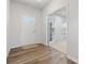 Bright foyer with wood flooring, a white door, and an adjacent office space at 1036 Barnette Farm Ln, Monroe, NC 28110