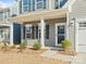 Inviting front porch with classic white columns, perfect for relaxing outdoors at 1036 Barnette Farm Ln, Monroe, NC 28110