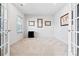 Well-lit carpeted office with french doors and ample natural light at 1036 Barnette Farm Ln, Monroe, NC 28110