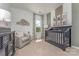 Charming Bedroom with crib and ample closet space at 1129 Red River Dr, Salisbury, NC 28144