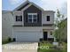 Two-story house with gray and beige exterior, two-car garage, and landscaped lawn at 1129 Red River Dr, Salisbury, NC 28144