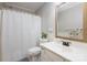 Bathroom featuring a shower-tub combo, white vanity, and a gold-framed mirror at 11918 Parks Farm Ln, Charlotte, NC 28277