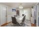 Bright dining room with large window, chandelier, and seating for six at 11918 Parks Farm Ln, Charlotte, NC 28277