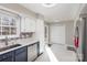 Kitchen boasts stainless steel appliances, white countertops, and ample cabinet space at 11918 Parks Farm Ln, Charlotte, NC 28277