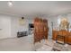 Living room featuring neutral walls, hardwood flooring, and a decorative folding screen at 11918 Parks Farm Ln, Charlotte, NC 28277