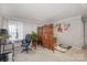 Bright living room with neutral walls, hardwood flooring, and a decorative folding screen at 11918 Parks Farm Ln, Charlotte, NC 28277