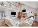 Bright living room with fireplace, high ceilings, ceiling fan, and upstairs loft overlook at 11918 Parks Farm Ln, Charlotte, NC 28277