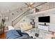 View of the living room staircase, fireplace, television and bright paint colors at 11918 Parks Farm Ln, Charlotte, NC 28277