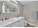 Bright bathroom boasts double sinks, modern lighting, and sleek finishes, offering a spa-like experience at 12325 Parks Farm Ln, Charlotte, NC 28277