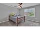 Neutral bedroom featuring a bed, carpet, and a window at 12325 Parks Farm Ln, Charlotte, NC 28277