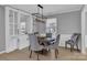 Dining room featuring a modern chandelier, built in shelving and natural light at 12325 Parks Farm Ln, Charlotte, NC 28277