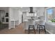 Bright kitchen featuring stainless steel appliances, quartz countertops and white cabinetry at 12325 Parks Farm Ln, Charlotte, NC 28277