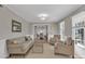 Bright living room featuring hardwood floors, neutral paint, and abundant natural light at 12325 Parks Farm Ln, Charlotte, NC 28277