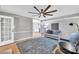 Cozy living room featuring neutral walls, plush rug, and comfortable seating, perfect for relaxation and entertaining guests at 12325 Parks Farm Ln, Charlotte, NC 28277