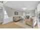 Spacious living room with hardwood floors, neutral paint, and an open concept dining area at 12325 Parks Farm Ln, Charlotte, NC 28277