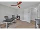 Bright office with hardwood floors, modern ceiling fan, and white painted trim at 12325 Parks Farm Ln, Charlotte, NC 28277