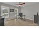 Bright office with hardwood floors, two windows, and a modern ceiling fan at 12325 Parks Farm Ln, Charlotte, NC 28277