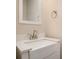 Bathroom featuring a white vanity, white countertop, silver faucet, and square framed mirror at 12584 Jessica Pl, Charlotte, NC 28269