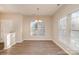 Spacious dining area featuring wood-style floors and abundant light, perfect for entertaining at 12584 Jessica Pl, Charlotte, NC 28269