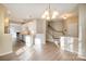 View of kitchen, staircase, and dining area featuring an open floor plan and wood floors at 12584 Jessica Pl, Charlotte, NC 28269