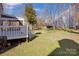 Large backyard with green grass and mature trees at 12822 Angel Oak Dr, Huntersville, NC 28078