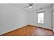 Simple bedroom with hardwood floors and a window at 12822 Angel Oak Dr, Huntersville, NC 28078