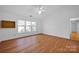 Main bedroom with hardwood floors and large windows at 12822 Angel Oak Dr, Huntersville, NC 28078