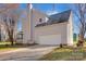 House exterior with attached garage and driveway at 12822 Angel Oak Dr, Huntersville, NC 28078