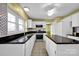 Kitchen with white cabinets, granite countertops, and stainless steel appliances at 12822 Angel Oak Dr, Huntersville, NC 28078