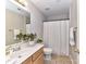 Bathroom featuring a wooden vanity, tile flooring, and neutral walls at 12907 Mccahan Ln, Huntersville, NC 28078