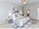 Serene bedroom featuring a ceiling fan, soft lighting, and neutral decor for a relaxing ambiance at 12907 Mccahan Ln, Huntersville, NC 28078