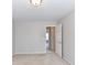 Neutral bedroom featuring light walls, carpeted floor, and paneled doors at 12907 Mccahan Ln, Huntersville, NC 28078