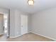 Neutral bedroom with a beige carpet, gray walls and bright ceiling light at 12907 Mccahan Ln, Huntersville, NC 28078